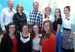 Claron Twitchell with missionaries at the Visitors Center of The Church of Jesus Christ of Latter-day Saints in Independence, Missouri